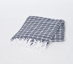 Cozy up on the couch with the Handwoven Cotton Throw from Pembroke Lane. The textured check pattern and soft cotton provide warmth and style for any living space.